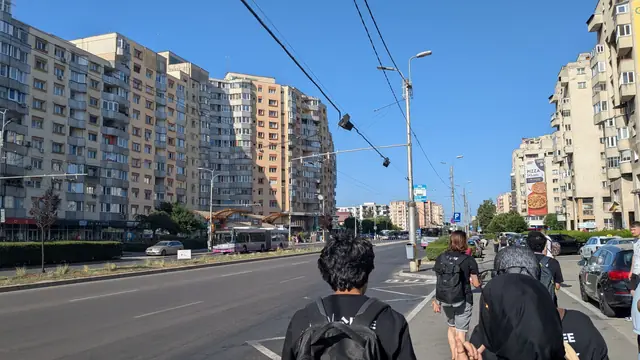 A sunny boulevard of apartment blocks and tram wires.