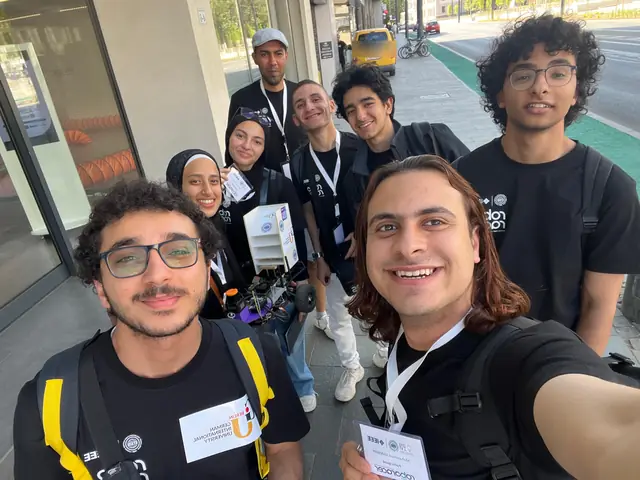 A selfie of the team on a Cluj pavement, the car and its lidar mast in the middle.
